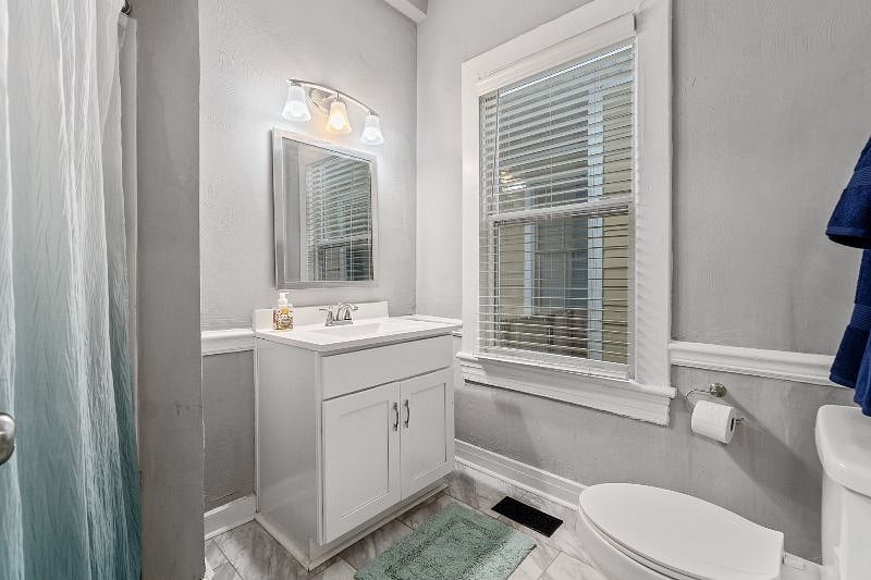 Downstairs Bathroom with a deep tub