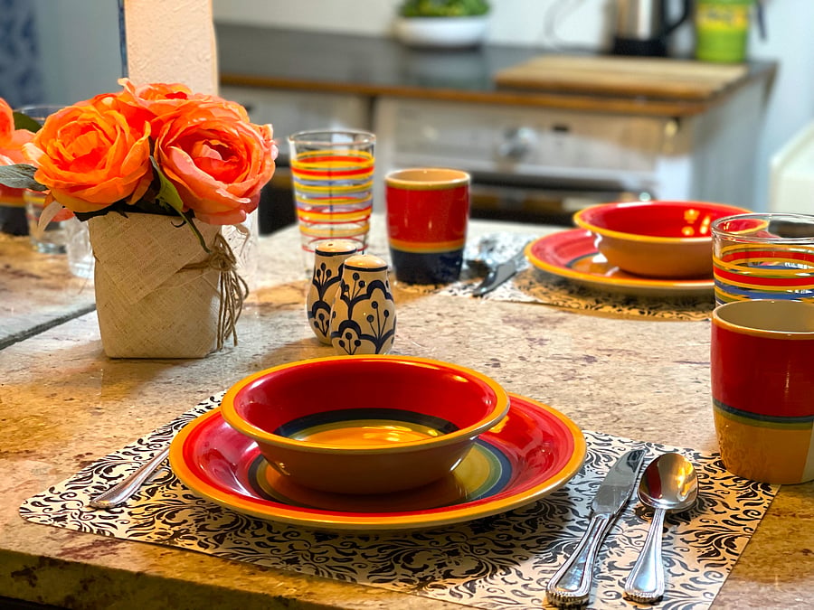 Marble top cafe table.
Dinnerware provided.