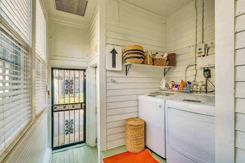 Laundry room off the kitchen leads to the backyard.