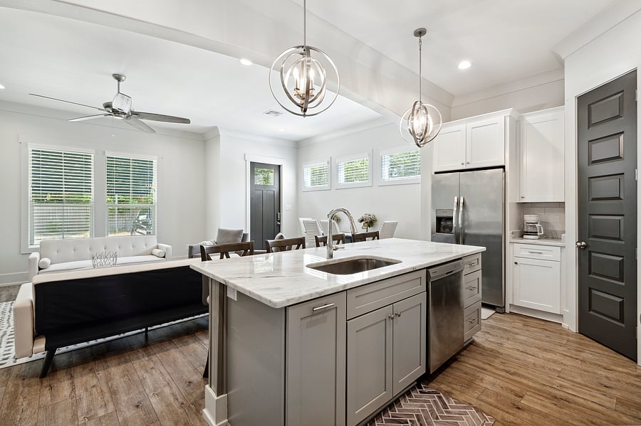 Wide access in front or back of kitchen island to hall, to king suite