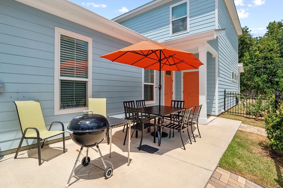 Outdoor patio from hall, coming in from beach straight to W/D. Grill optional, as your rental bikes or golfcart could be parked at back door