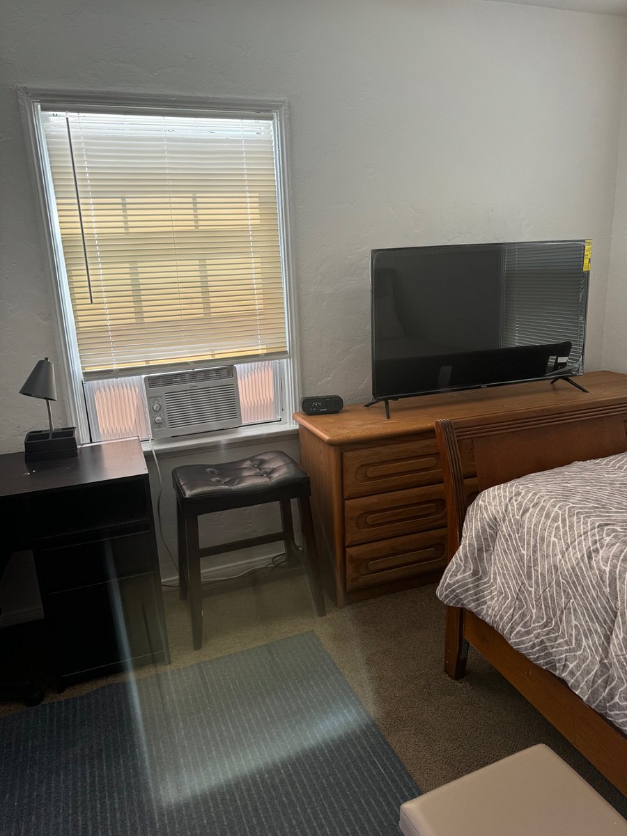 Air conditioning unit, 55 TV, dresser with 9 drawers and alarm clock with phone jacks