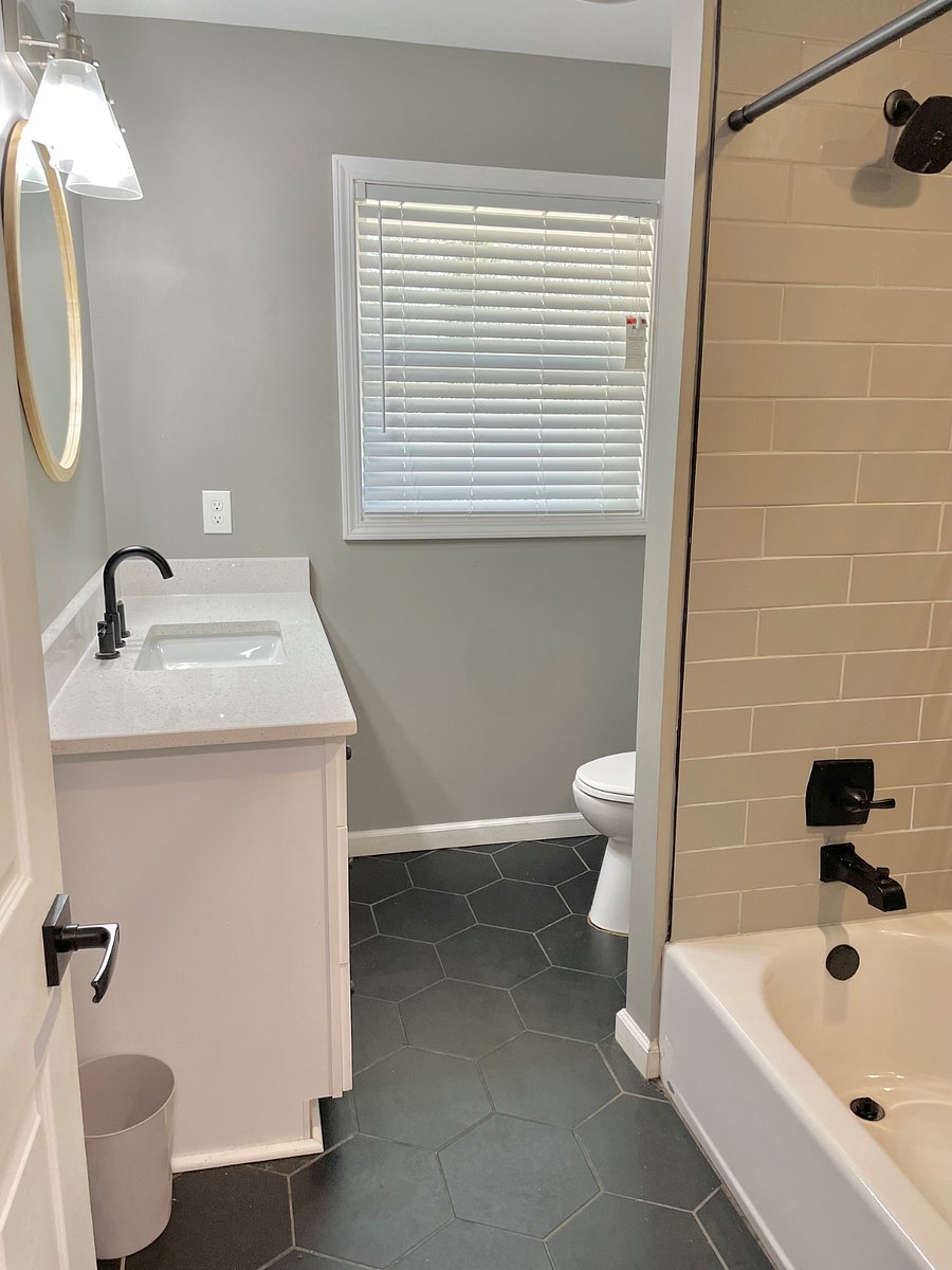 Hallway bath with separate toilet vent and shower venting to prevent excessive  steam buildup 