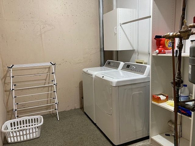 Walk from the garage into the laundry area.