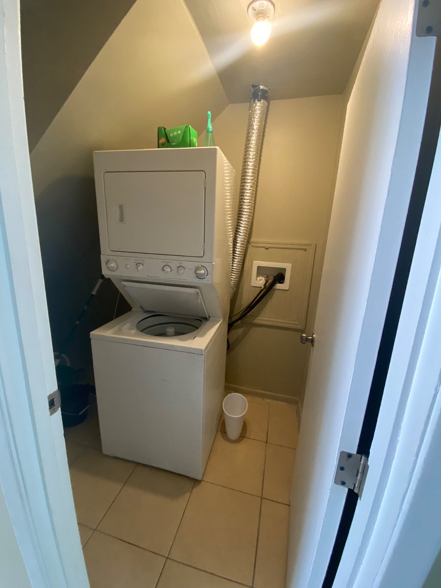 First Floor Storage area with a washer and dryer