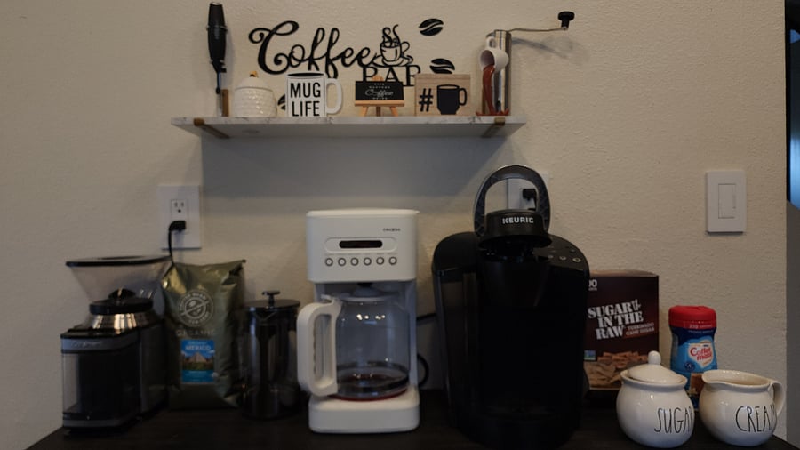 Coffee Bar includes Drip, French press and Kuerig Coffee Makers, as well as Kuerig Pods and Whole Bean Coffee, Whole Bean Coffee Grinder and Milk Frother. There is also Cream, Sugar, Tea and Hot Cocoa.