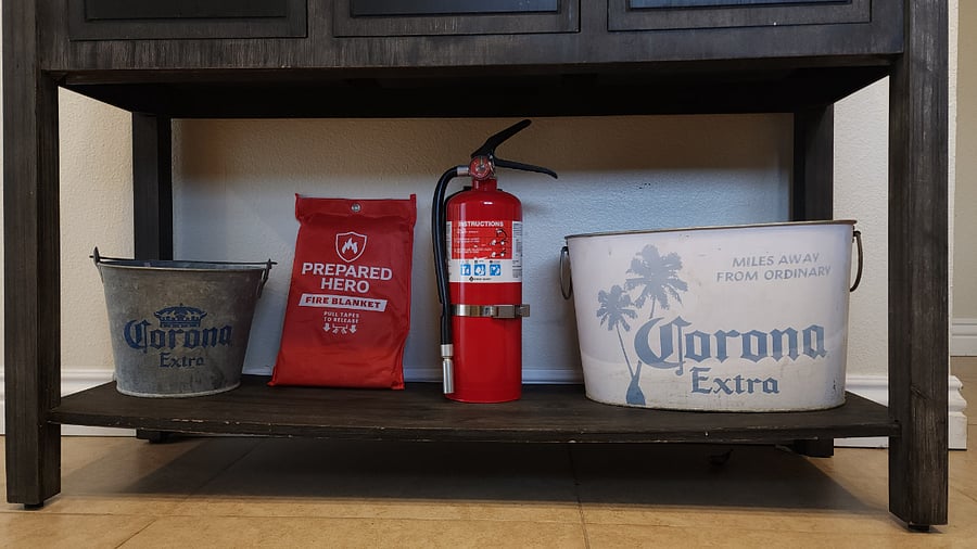 Below the Coffe Bar you will find an Emergency Fire Blanket and Fire Extinguisher along with Buckets for Ice and Beverages
