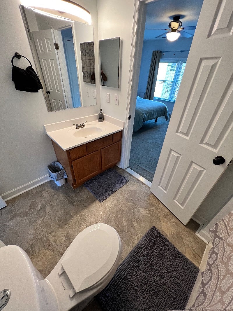 Full bath stocked with a hairdryer and light toiletries.  