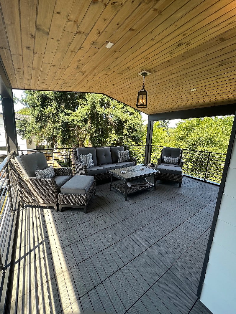 Expansive deck off of primary bedroom over the garage
