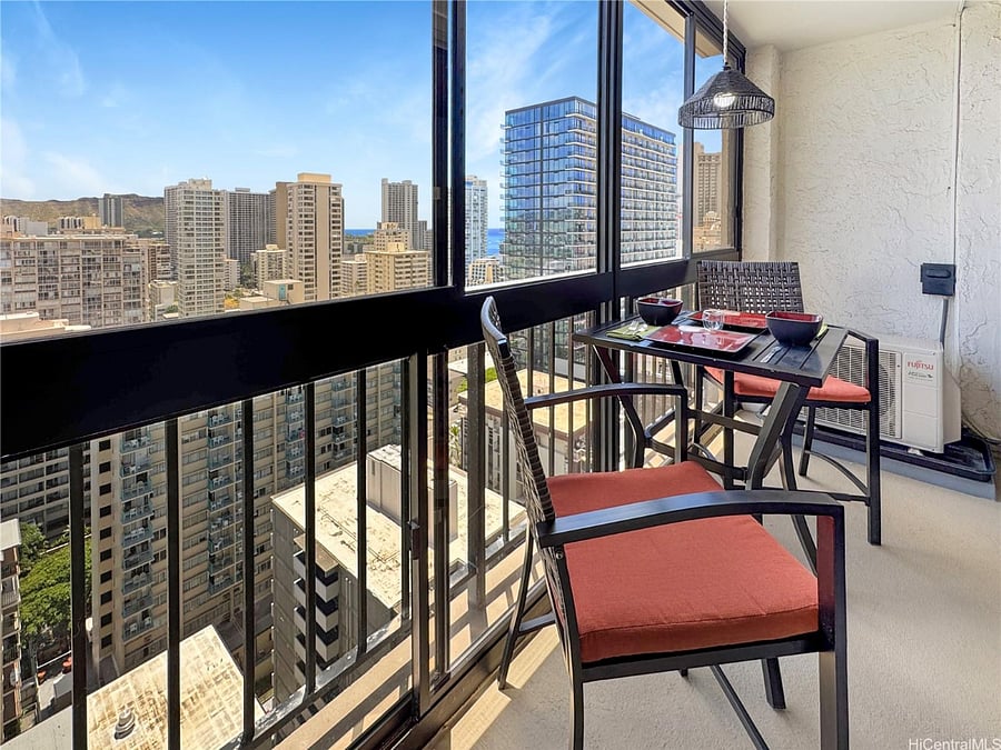 Semi balcony area with table and two bar stools