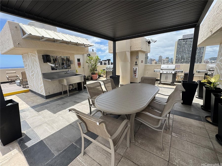 Roof top tables, chairs, BBQ area and swimming pool.
