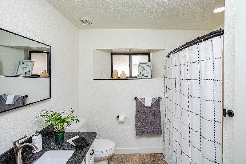 Bathroom with tub and shower