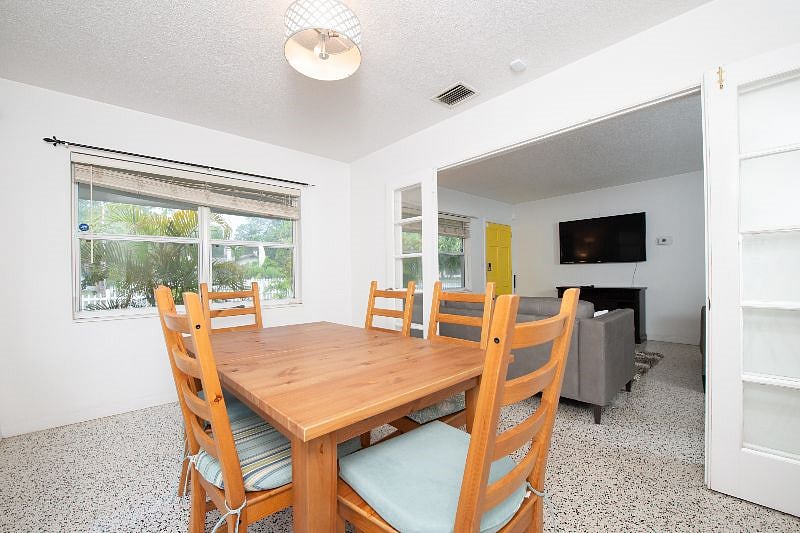 Dining room with view of living room and front door