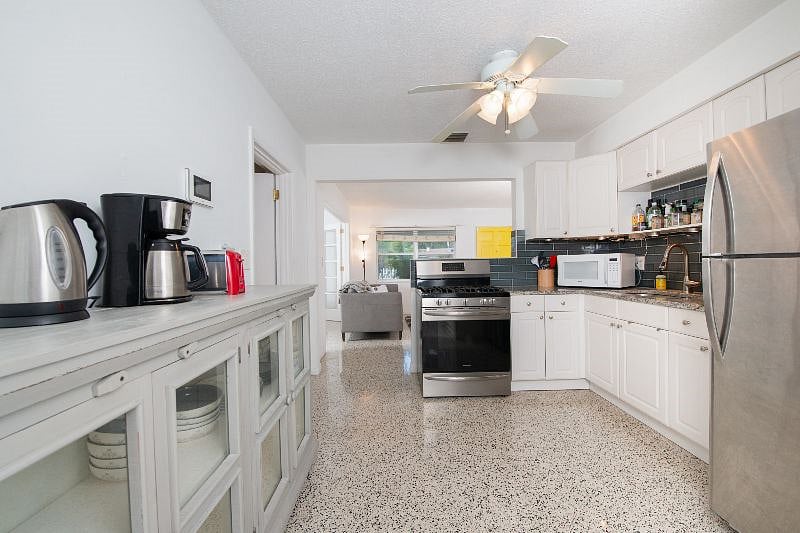 view from back of kitchen to front of house