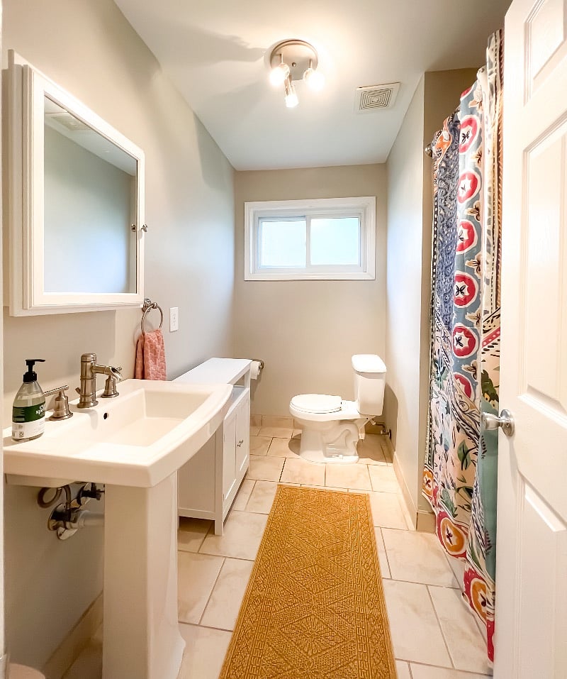 Main hall bathroom has shower/tub combo