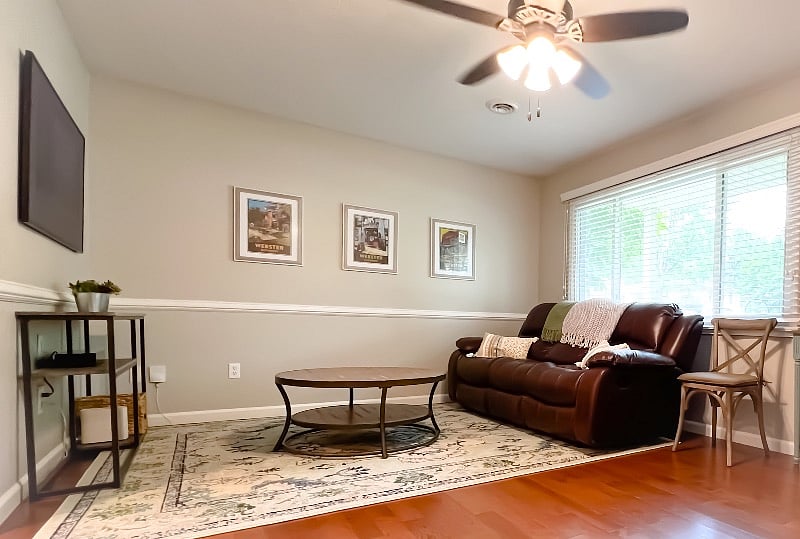 Living room. The two end seats on the sofa both recline
