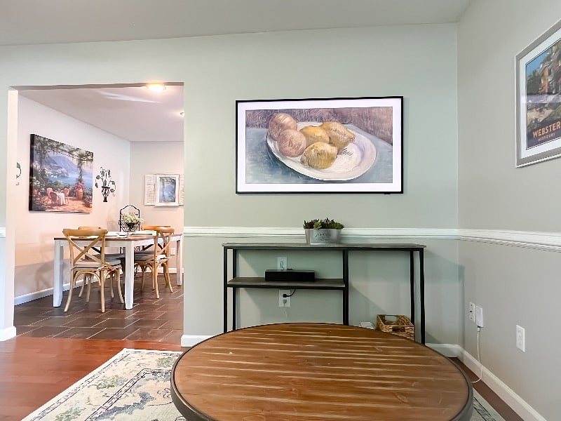 Living room with "The Frame" TV displaying still art