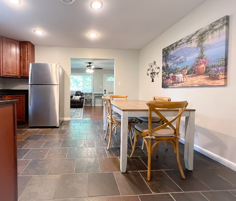 The eat-in kitchen flows well to the front and back of the house