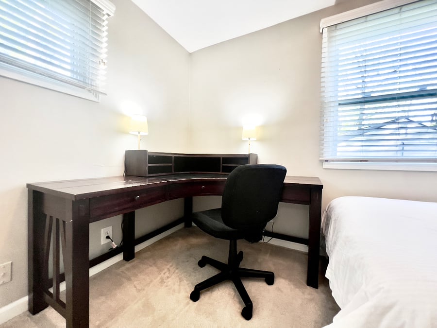 3rd bedroom with executive desk can be used as an office or as a bedroom