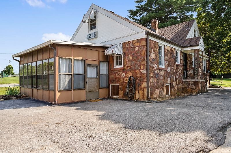 Great sunroom with lounging area and workout equipment.