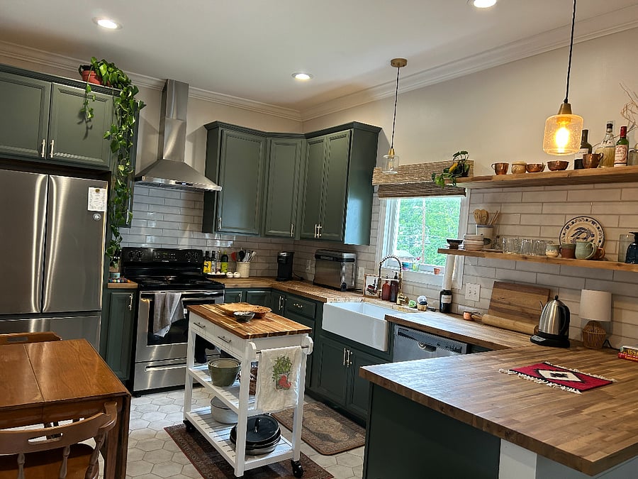 Beautiful stocked kitchen with utensils, dishes and cookware