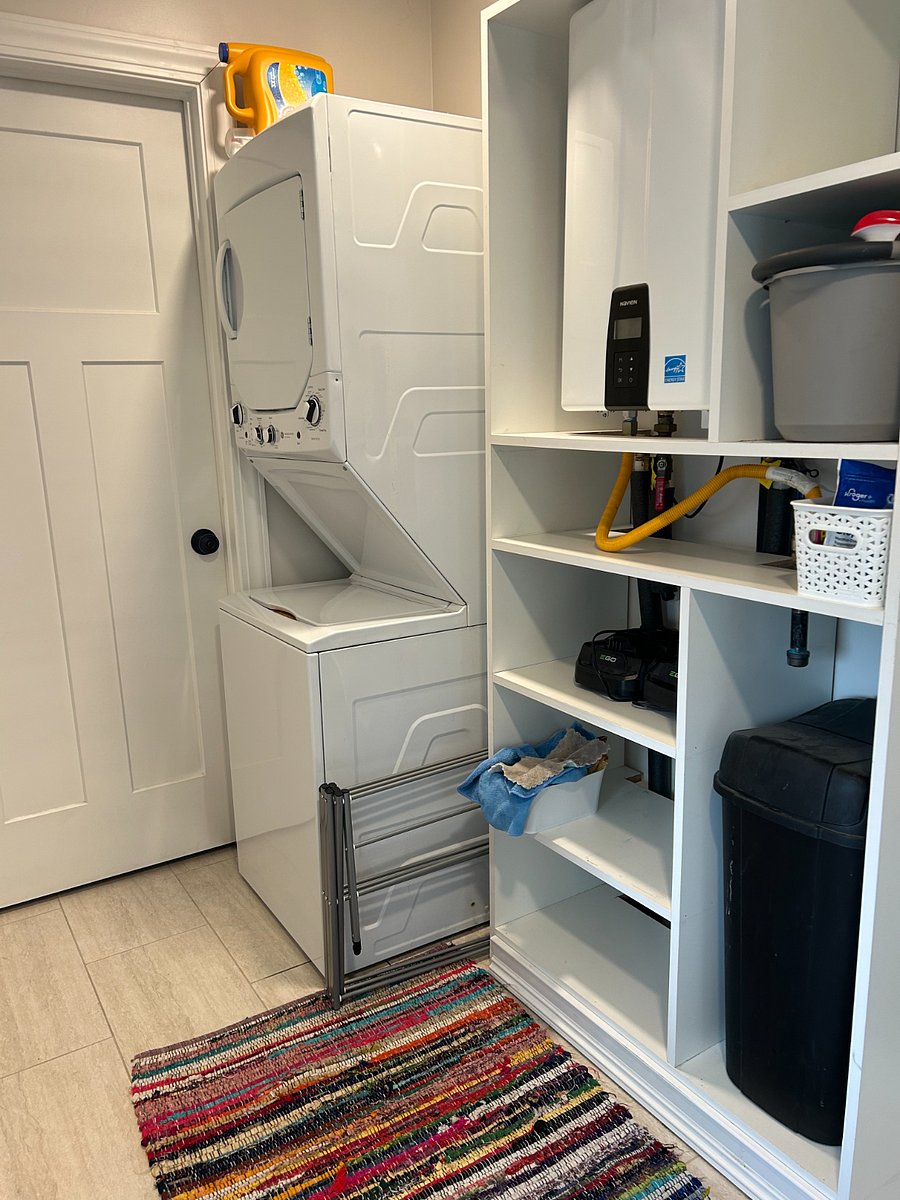 Stacked washer and dryer and tankless on demand water heater