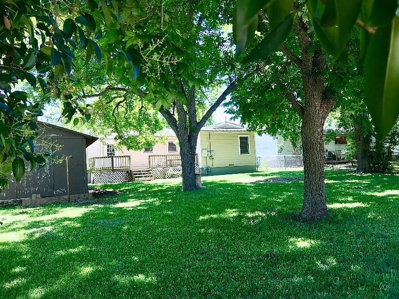 Spacious, shady backyard w/deck and fire pit. Lawn services and pest control are included.