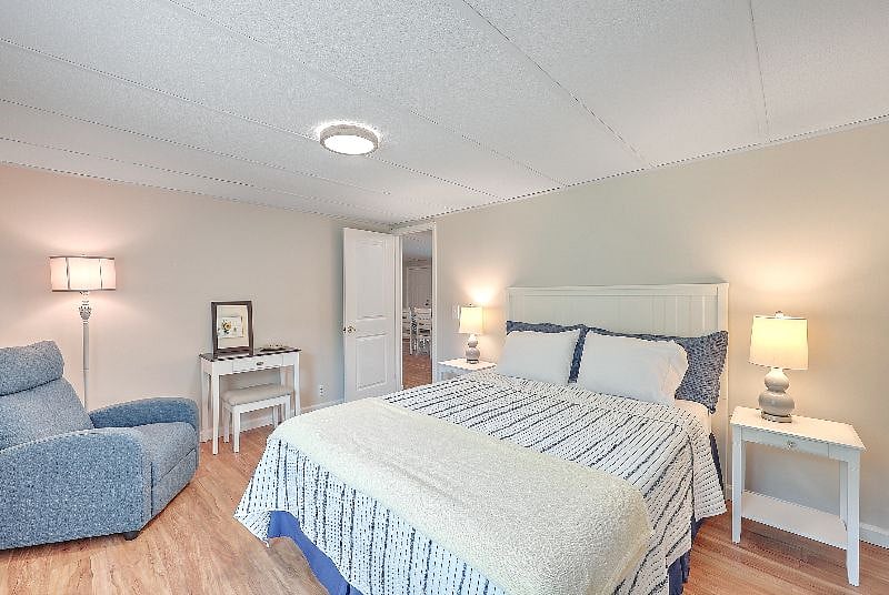 Second bedroom with a rocker chair.