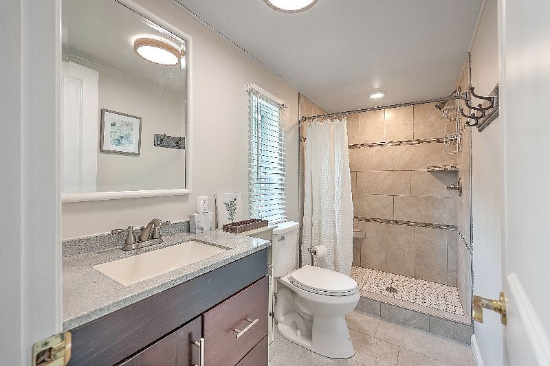 Master bathroom with tiled shower.