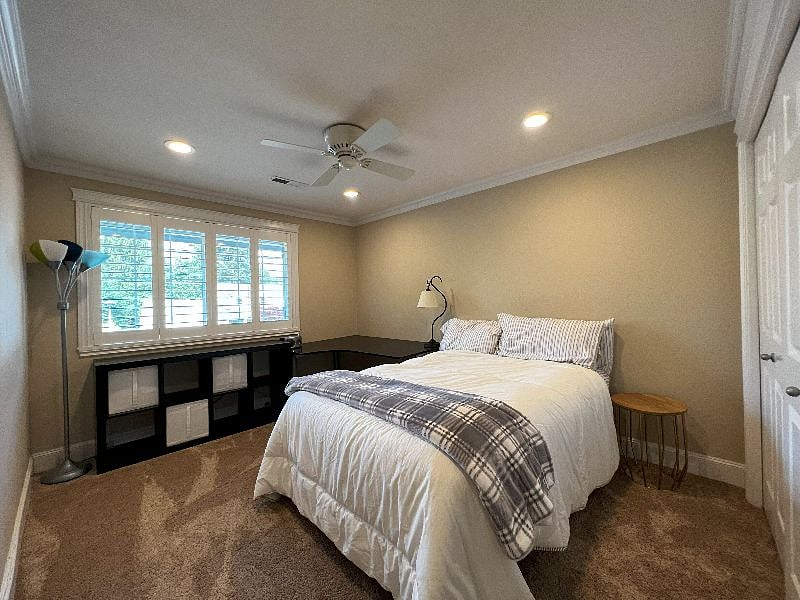 Bedroom 1, queen bed. All bedding provided. Housecleaning every 2 weeks vacuum and will change sheets. L shaped desk, office chair, desk lights, bookshelf storage, large closet.