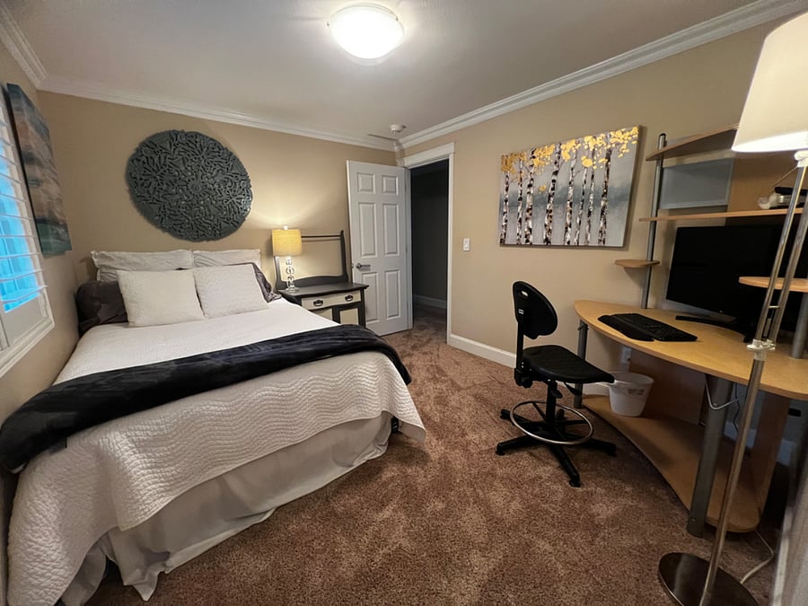 Bedroom 3 (Photo 2), queen bed. All bedding provided. Housecleaning every 2 weeks - vacuum and will change sheets. Desk/Monitory, office chair, desk lights, Floor lamp, large closet.