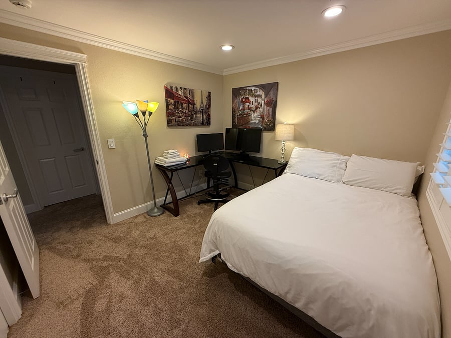 Bedroom 2, (Photo 1) queen bed. All bedding provided. Housecleaning every 2 weeks vacuum and will change sheets. L shaped desk, office chair, desk lights, large closet.