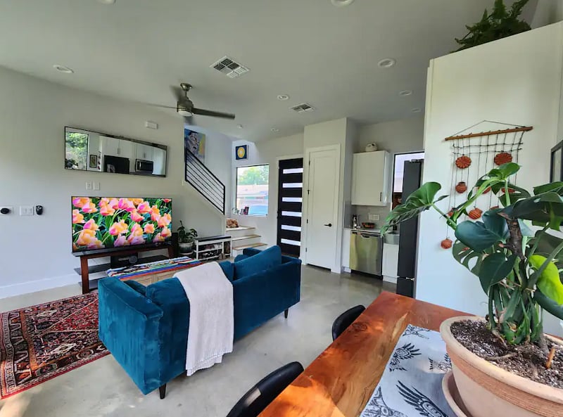 Expansive open floor plan seamlessly combines living, dining, and kitchen areas.