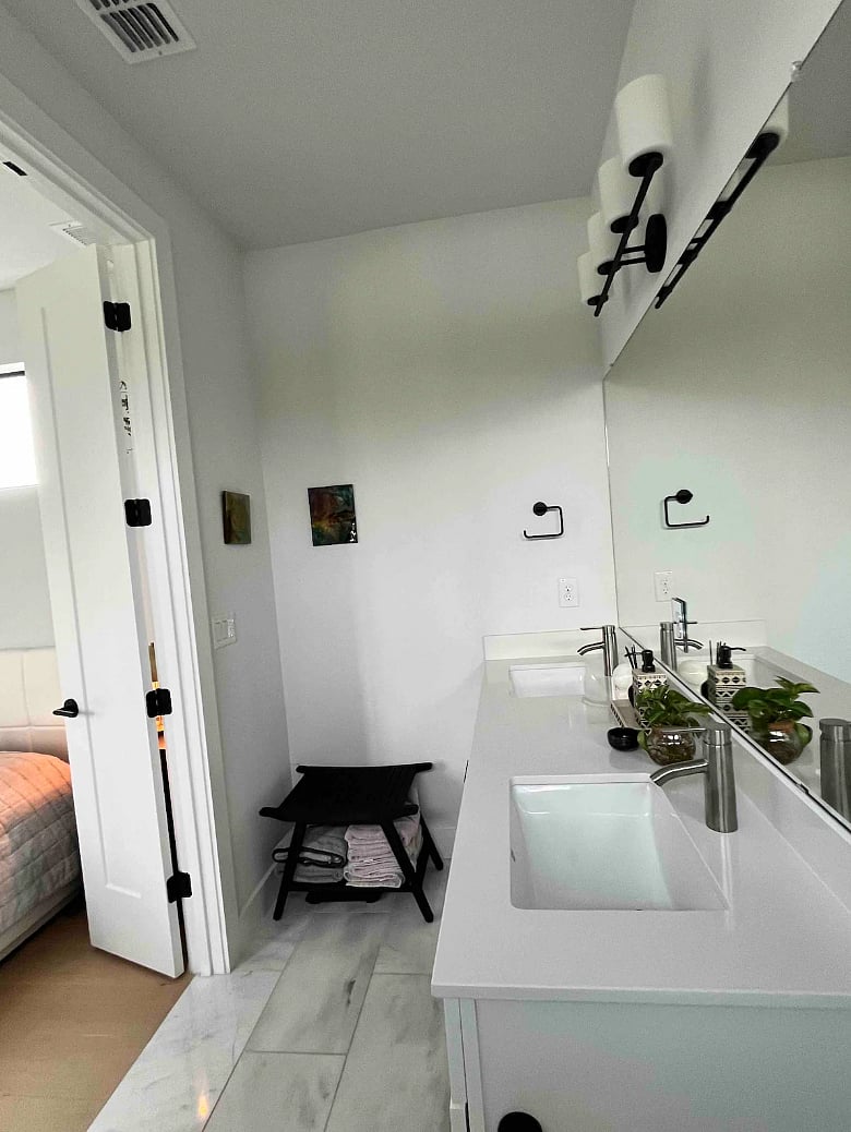 Double sink vanity in the master bathroom, providing ample storage.