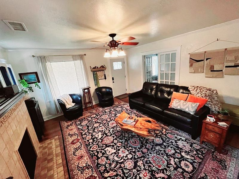Living room with blue tooth speaker, record player and smart TV, amazon firestick couch, 2 additional chairs and bench seat for additional seating 