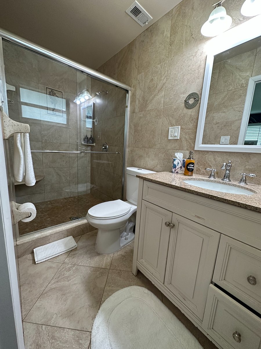 Master step in bathroom shower, no glass door