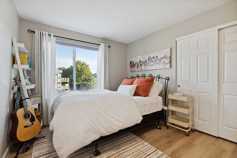 3rd bedroom with blackout shades and attached bathroom
