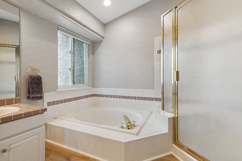 Primary bath with soaking tub, shower and make up area, 2 sinks