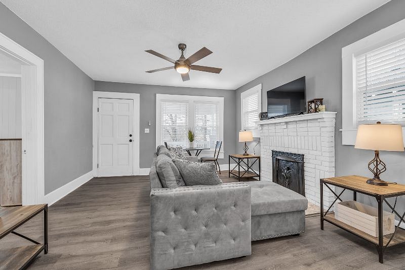 Cozy living room opens to dining room and kitchen.