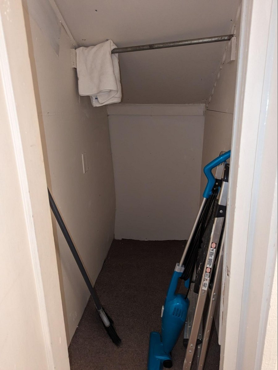 hall closet next to bathroom