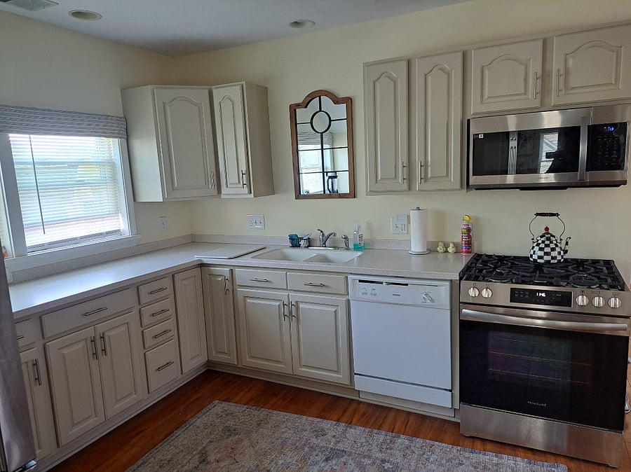 Kitchen with new gas stove and new microwave plus dishwasher.