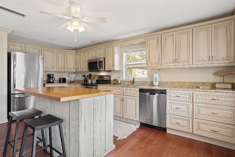 Kitchen island with 2 additional seating spaces. 