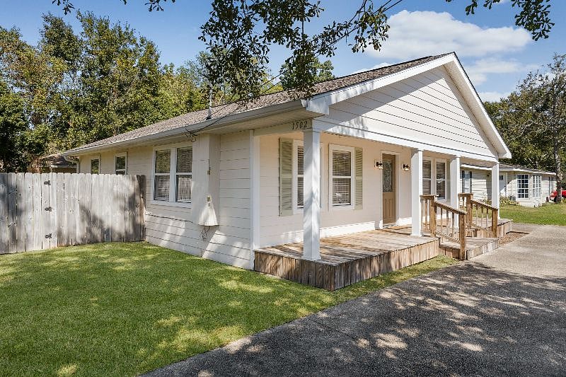 House with fenced-in backyard. 