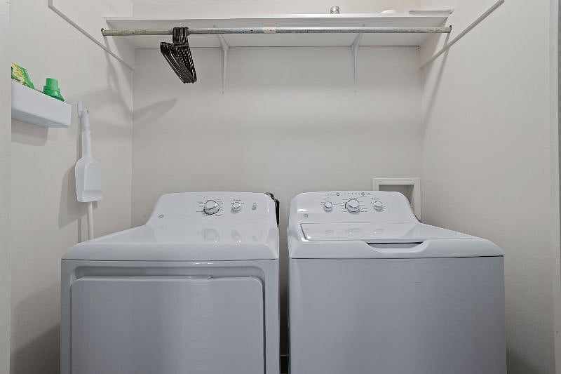 Washer and dryer in unit. 