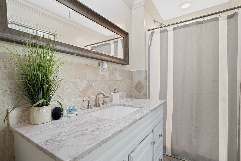 Master suite bathroom with standing shower. 
