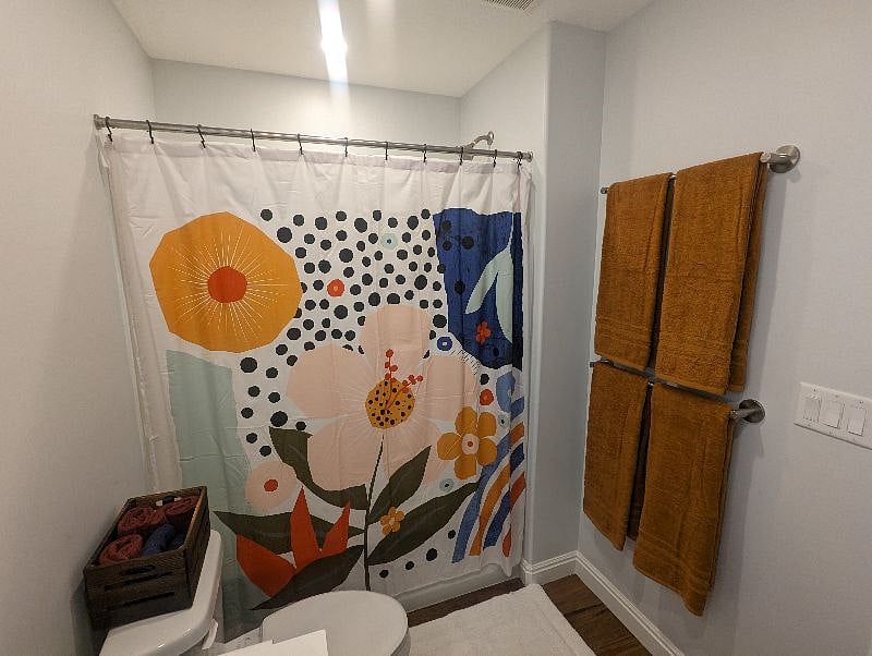 This bathroom is great. You have a light over the shower on its own separate dimmer, two lights over the toilet and sink on a dimmer, and even the mirror is illuminated with its own dimmer. All the lighting is a warm and flattering 2700k 