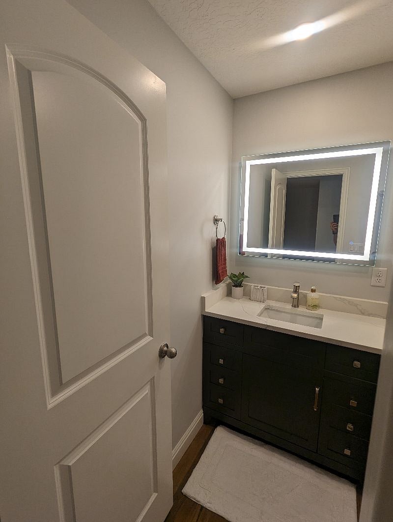 This bathroom is great. You have a light over the shower on its own separate dimmer, two lights over the toilet and sink on a dimmer, and even the mirror is illuminated with its own dimmer. All the lighting is a warm and flattering 2700k 