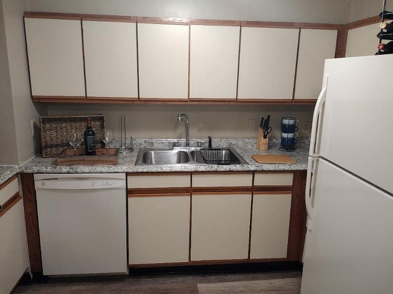 Lower Level Living Area Guest Kitchen Sink, DW, and Refrigerator, washer/Dryer, and built-in ironing board
