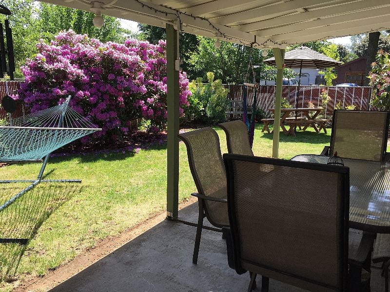 fenced side yard and covered patio