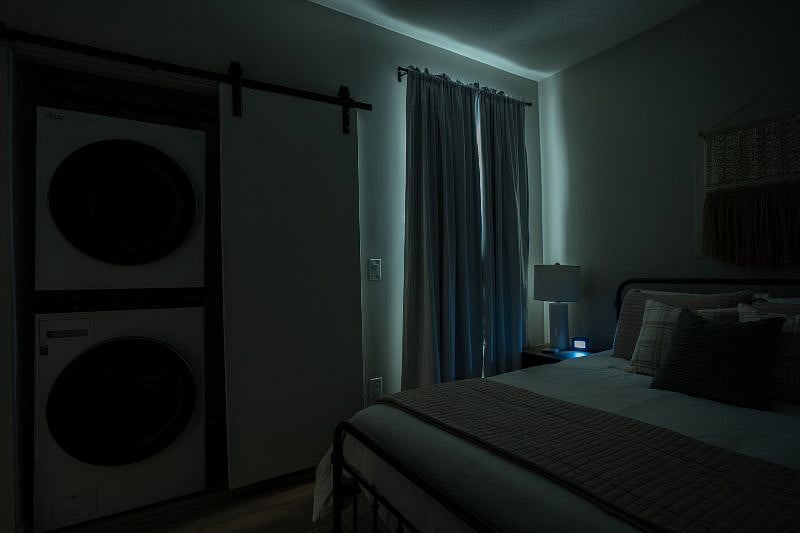 This picture was taken at 1:00 PM to feature the blackout curtains. The photo used long exposure like how you would photograph the milky way at night.